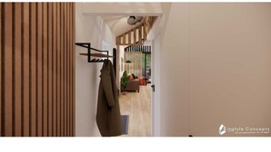 A modern interior with a wooden slat wall, a coat rack, and a seating area with a sofa and cushions. - 6-person holiday home for relaxing retreat. (Balkbrug)