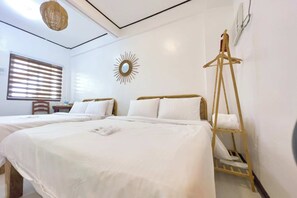 Habitación Deluxe con 2 camas individuales | Camas extra y ropa de cama 