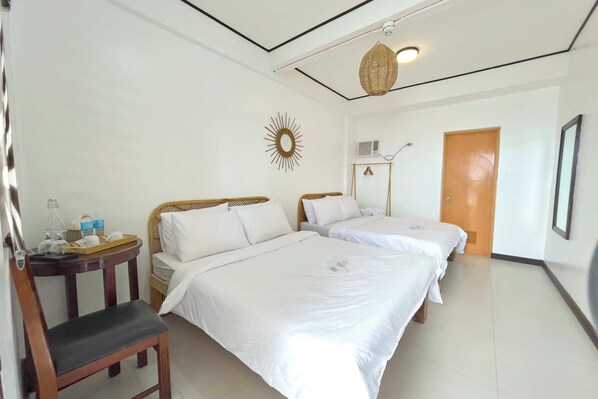 Habitación Deluxe con 2 camas individuales | Camas extra y ropa de cama 