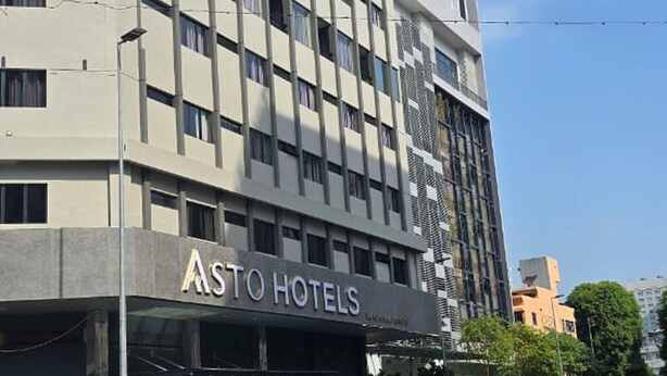 A multi-story hotel building with a modern facade, featuring a prominent "Asto Hotels" sign at the ground level. - asto hotel (Kuala Lumpur)