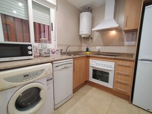 Superior Apartment, Balcony | Private kitchen | Fridge, microwave, oven, stovetop