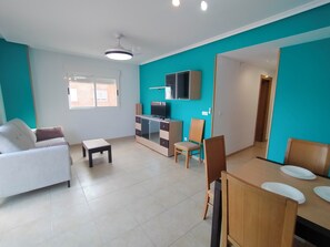 Superior Apartment, Balcony | Living area | 32-inch LED TV with digital channels