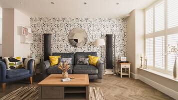 TV, fireplace, books