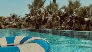 Outdoor pool, open 10:00 AM to 6:30 PM, pool umbrellas, sun loungers