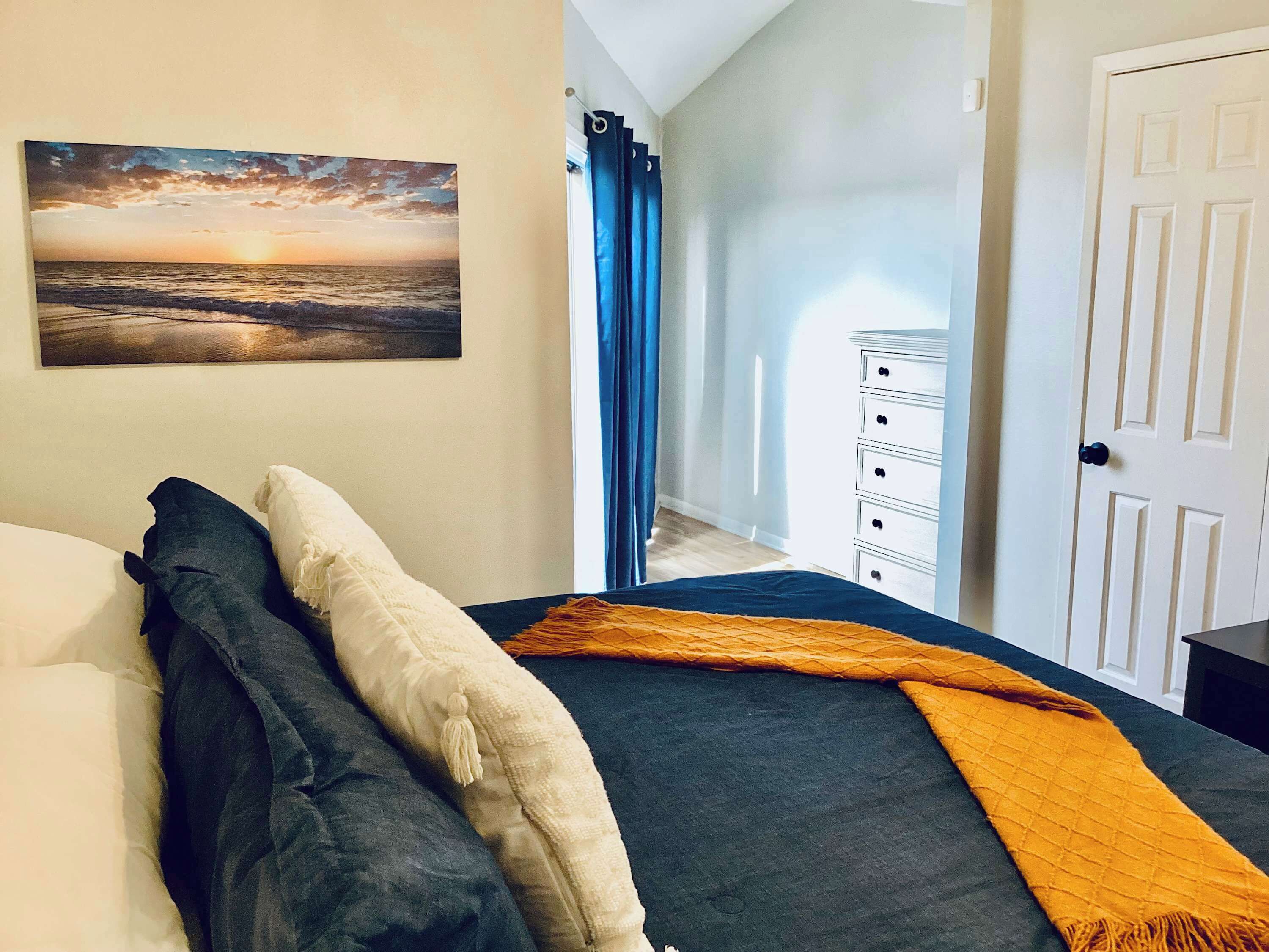 Bedroom 1 with king bed, balcony, and Smart TV