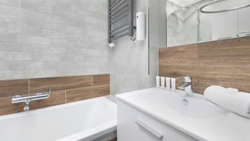 Shower, hair dryer, towels, shampoo