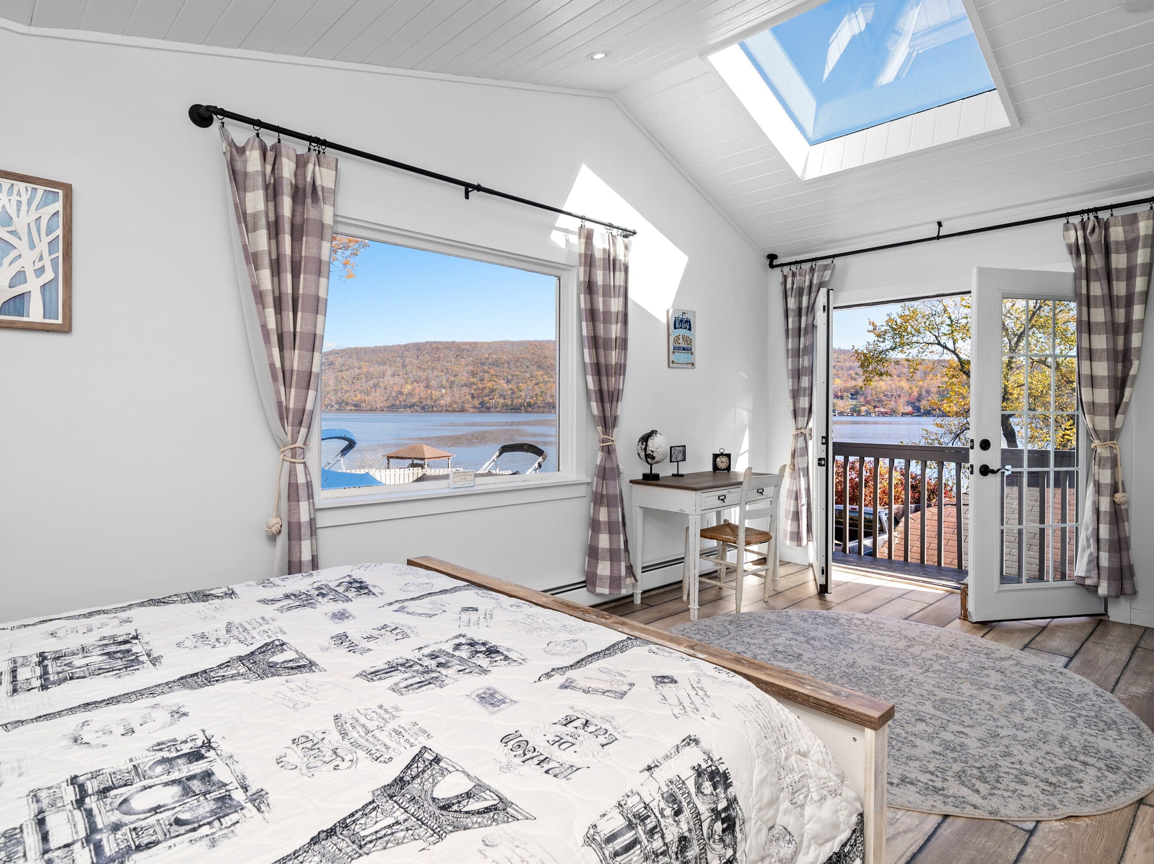 Queen master bedroom with lake-view balcony