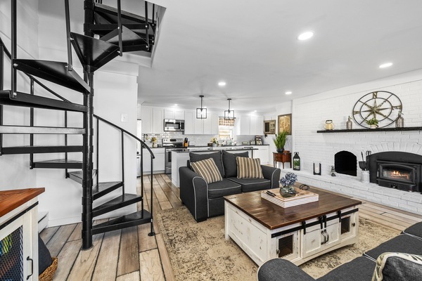 Charming spiral staircase connects living room to bedrooms
