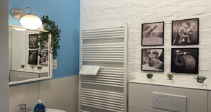 Shower, eco-friendly toiletries, hair dryer, towels