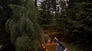 A garden with a flag, stone steps, and a fire pit. - 4BR Mtn Retreat w/ Hot Tub, Game Rm & 2 Kitchens – 15 Mins to North Conway! (Conway)