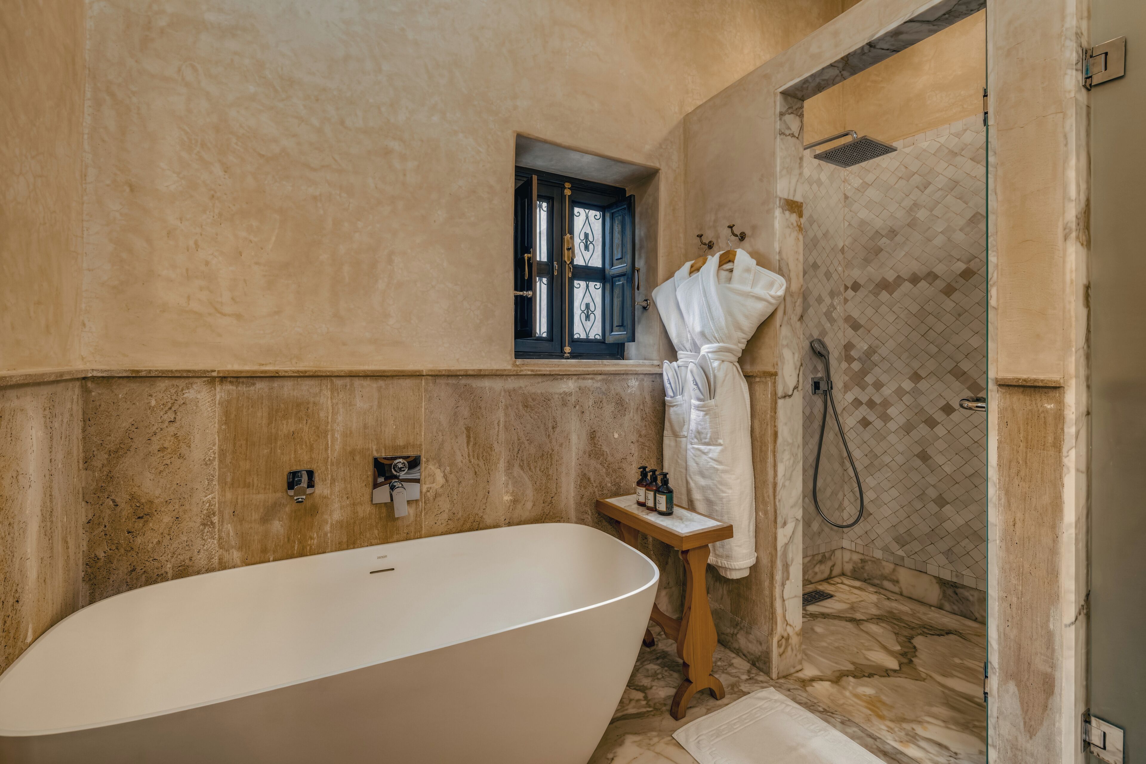 Deluxe Suite | Bathroom | Hair dryer, slippers, towels, soap