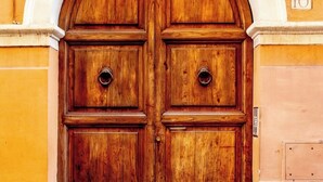 A large wooden double door with a number '10' above it. - TRASTEVERE CAMPO de FIORI ROME by FOOT-NETFLIX-AIRCOND-WIFI (Roma)