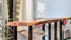 A wooden table with metal legs in a furniture store. - Stunning 2 bed in Sadaf 6 (Dubai)