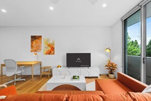 TV, offices - Central art-filled 2 beds with balcony & aircon (Surry Hills)