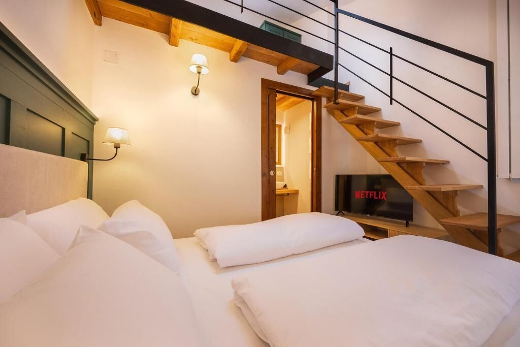 Deluxe Triple Room, Mountain View | Minibar, in-room safe, blackout drapes, free WiFi