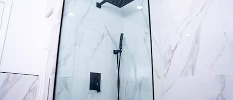 Shower, hair dryer, towels, shampoo