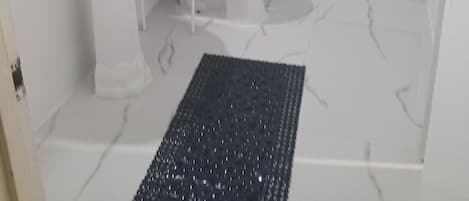 Shower, towels, soap, toilet paper