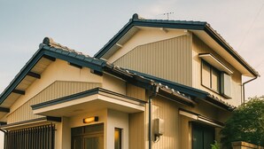 A two-story house with a front entrance, a bicycle parked outside, and a small garden area. - One building for rent. Fujigaoka is a 15-minute walk and Ghibli Park is a 20-minute drive. 2 parking spaces. Convenience store and supermarket within walking distance. Ideal for families and pets. (名古屋市守山区森孝東)