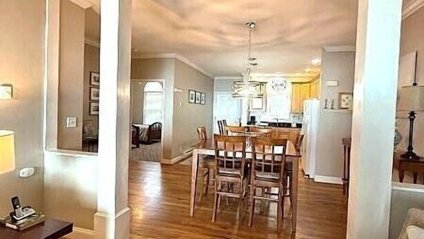 A spacious living room with a wooden floor, a dining area with a table and chairs, and a kitchen in the background. - KLTA6  Beach to Beech Villa  2 BR/2 BA Condo Walking distance to Town (Beech Mountain)