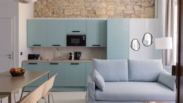 Appartement, 1 slaapkamer | Gemeenschappelijke keuken | Een koelkast, een microgolfoven, een oven, een vaatwasser
