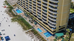 A multi-story hotel with balconies, a pool, and beach access. - Emerald Isle 1301 - New listing! Front row beach chairs included! (Panama City Beach)