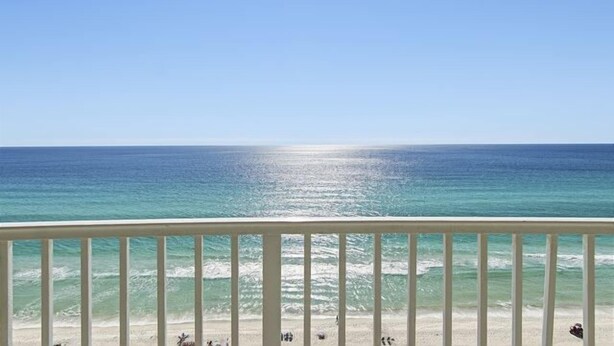 A balcony with a view of the ocean and beach. - Emerald Isle 1301 - New listing! Front row beach chairs included! (Panama City Beach)
