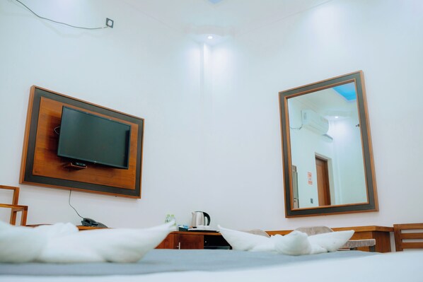 Deluxe Double Room, Balcony, City View | Minibar, in-room safe, desk, laptop workspace