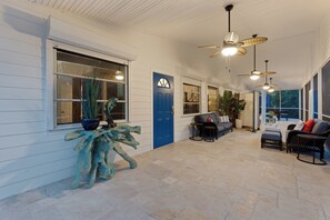 A covered outdoor area with seating, ceiling fans, and potted plants. - ☀️Perfect for Large Groups/Families | Private Preserve Access | Flamingo Bayou☀️ (Fort Myers Beach)