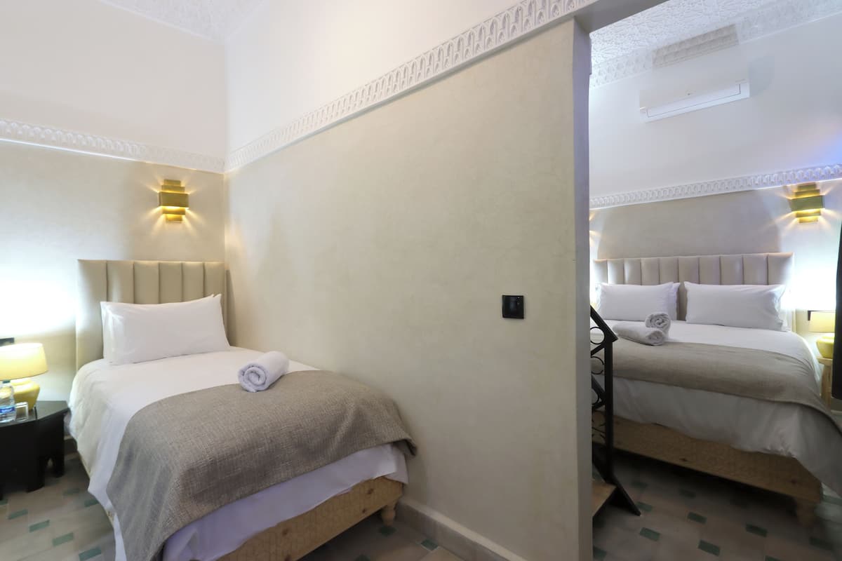 Family Quadruple Room, Courtyard View | In-room safe, blackout curtains, free WiFi