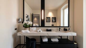 Luxury Suite, Balcony | Bathroom | Shower, hair dryer, slippers, towels