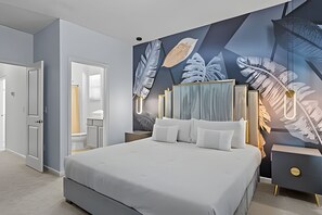 A modern bedroom with a large bed, a nightstand, a dresser, and a wall mural. - Luxurious 9BR Paradiso | Pool, Cinema & Game Room (Orlando)