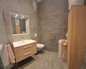 Shower, towels, soap, toilet paper