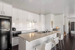 Coffee/tea maker, fridge, microwave, oven