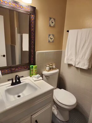 Shower, hair dryer, towels, soap