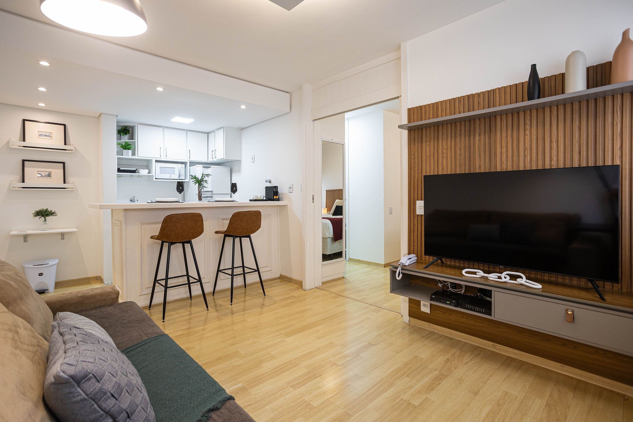 Apartamento empresarial | Área de estar | TV