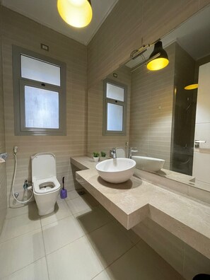 Shower, towels, soap, toilet paper - Furnished Apartment in The Village Gate - NEW CAIRO  by palm hills. (cairo)