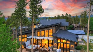 A modern house with a deck, outdoor seating, and a fire pit. - ✨ Soltierra • 🏔️ Breck Peak 8 • 🎿 Ski-In • 💦 10-Person Spa • 🛏️ 13 Beds (Breckenridge)