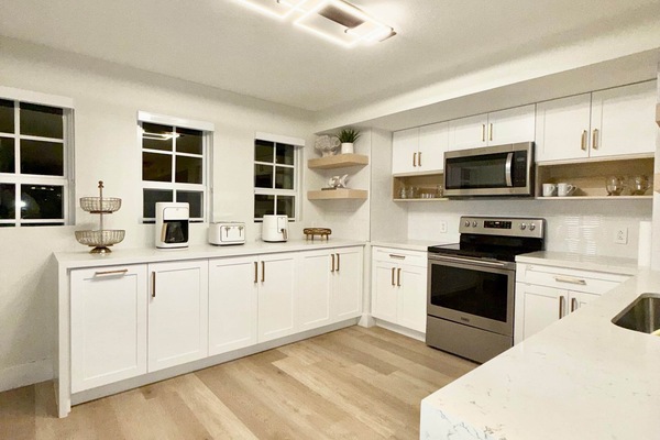 Gourmet kitchen with quartz counters and premium appliances.