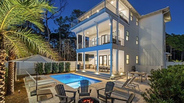 A two-story house with a pool, outdoor seating, and a fire pit. - Pelayo Solage|Deeded Beach Access|Private Pool|Golf Cart & Bikes (Santa Rosa Beach)