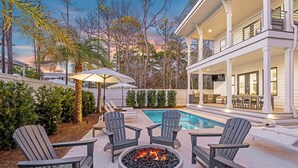 A poolside area with Adirondack chairs, a fire pit, and a pool. - Pelayo Solage|Deeded Beach Access|Private Pool|Golf Cart & Bikes (Santa Rosa Beach)