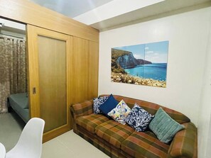 Apartment, 1 Bedroom, Smoking, Balcony | Living area - Elegant Pasay City Apartment With Central Heating & Shared Pool (Pasay)