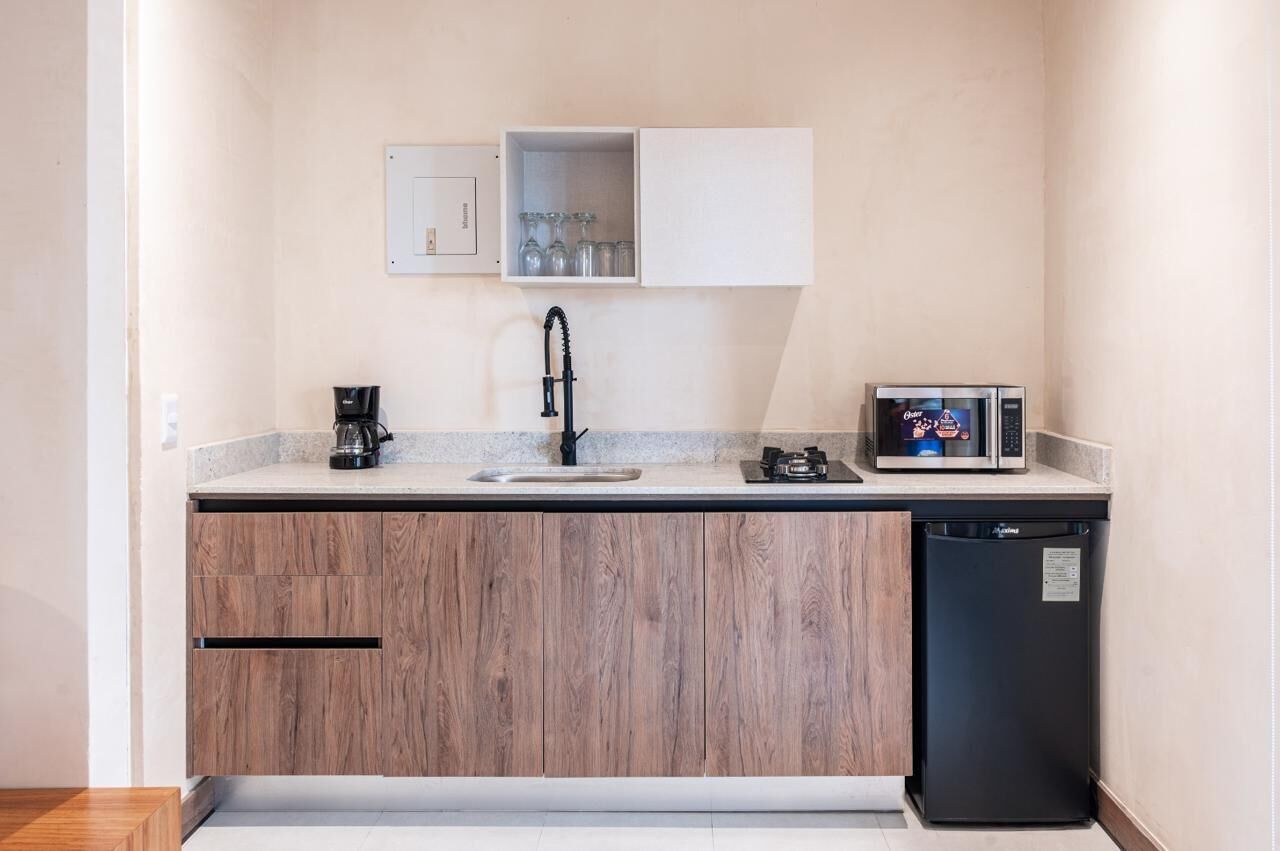 Mini-fridge, microwave, stovetop, cookware/dishes/utensils