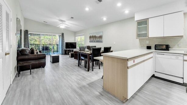 A modern apartment with a kitchen, dining area, and living room. - Peaceful 2BR Condo by Golf Course & Pools (Branson)