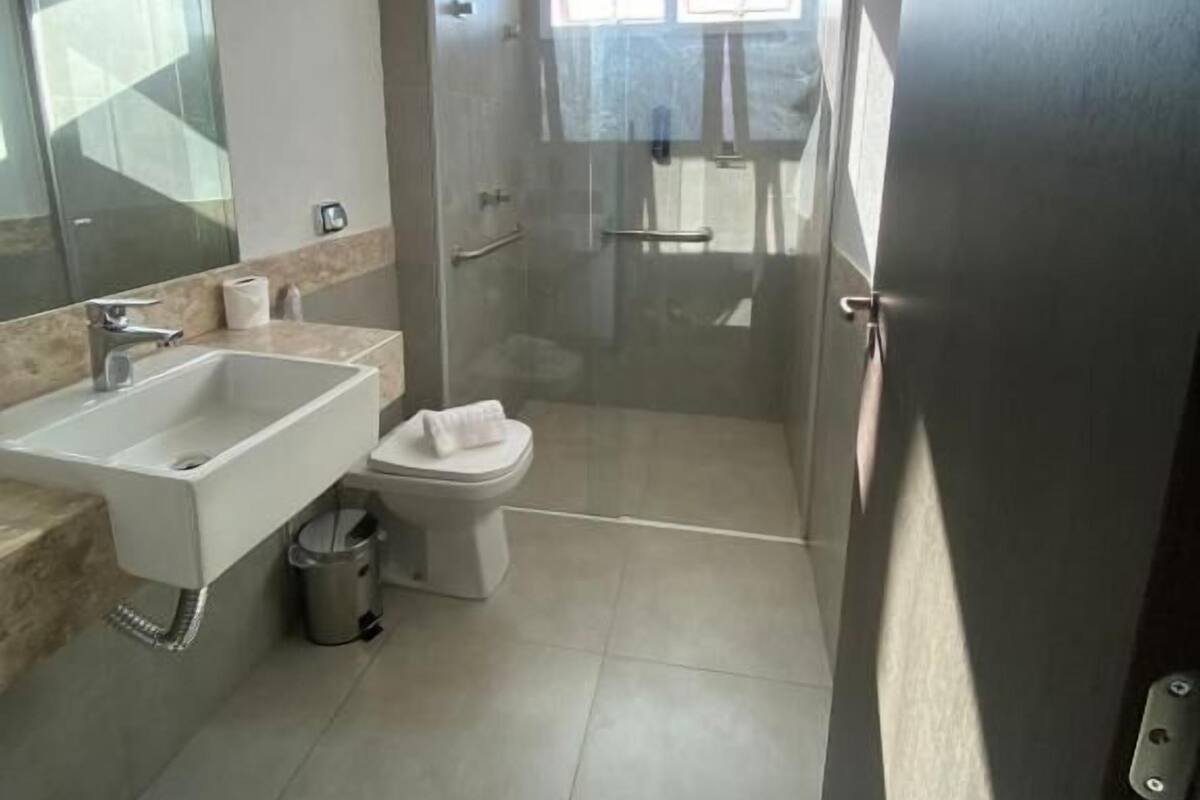 Shower, hair dryer, towels, soap