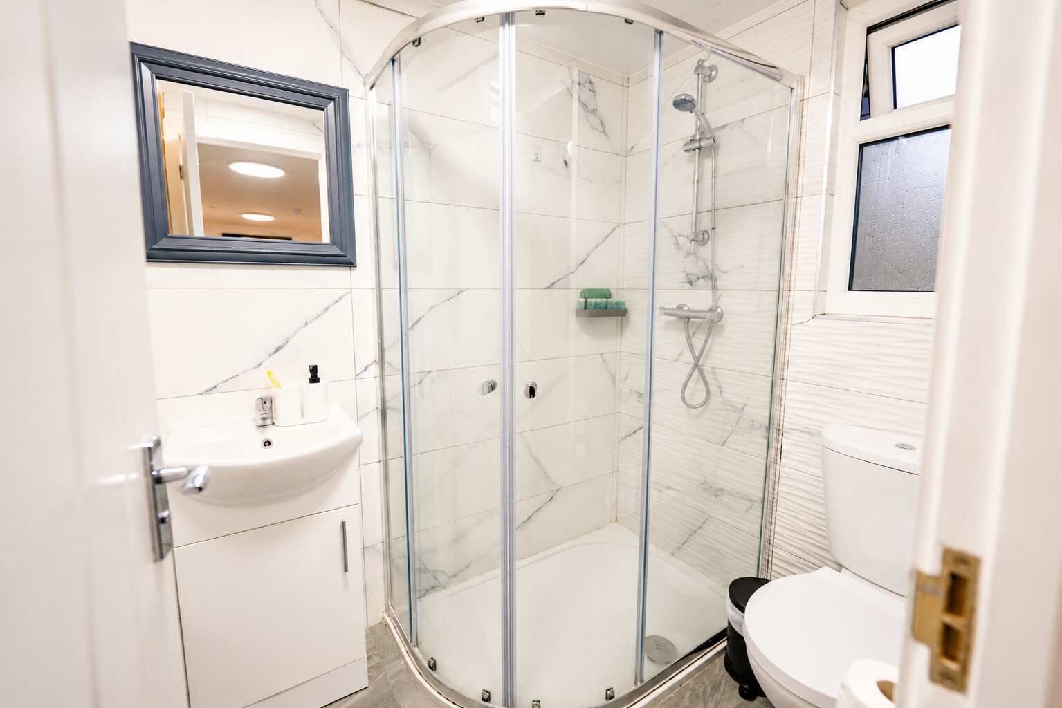 Shower, hair dryer, towels, shampoo