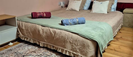 1 bedroom, desk, iron/ironing board, travel crib