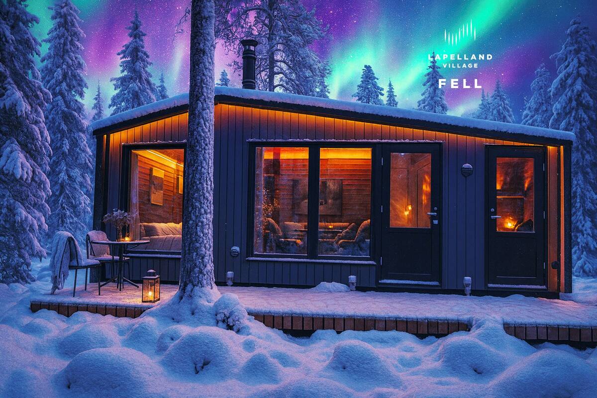 A cozy cabin with a wooden exterior, large windows, and a fireplace visible through the windows.