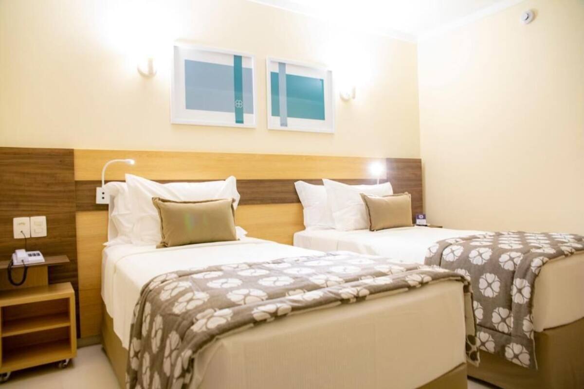 Standard Twin Room | In-room safe, desk, laptop workspace, blackout drapes