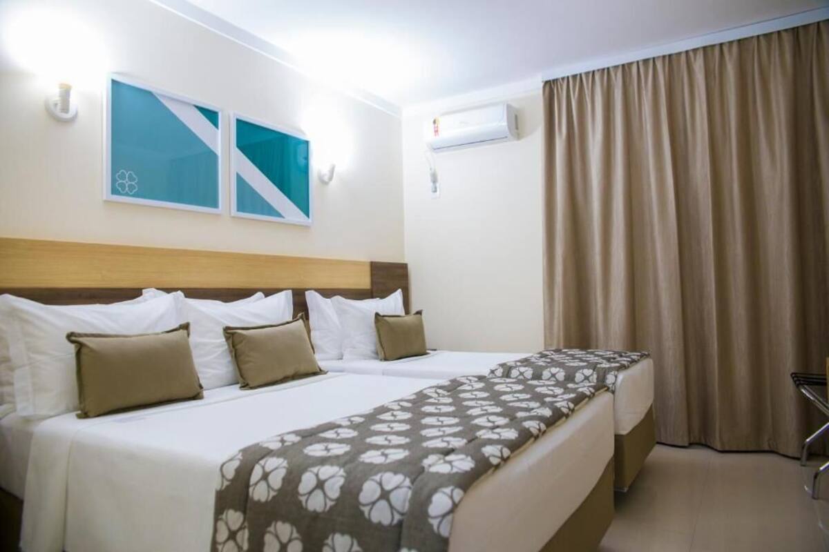 Standard Triple Room | In-room safe, desk, laptop workspace, blackout drapes
