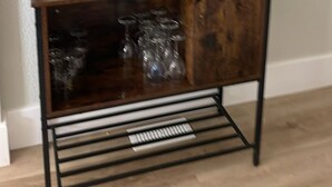 A wooden desk with a lower shelf, a star decoration, and a small plant on the top shelf. - Dean's Seaside Escape,
Beautiful beaches and awesome sunrise and sunsets! (Cape Tormentine)